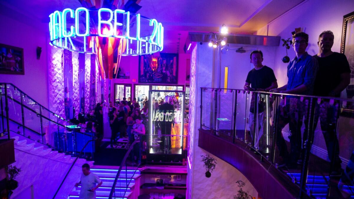 People hang out in the Demolition Man Taco Bell 2032 activation space during the first day of the 2018 San Diego Comic-Con International.