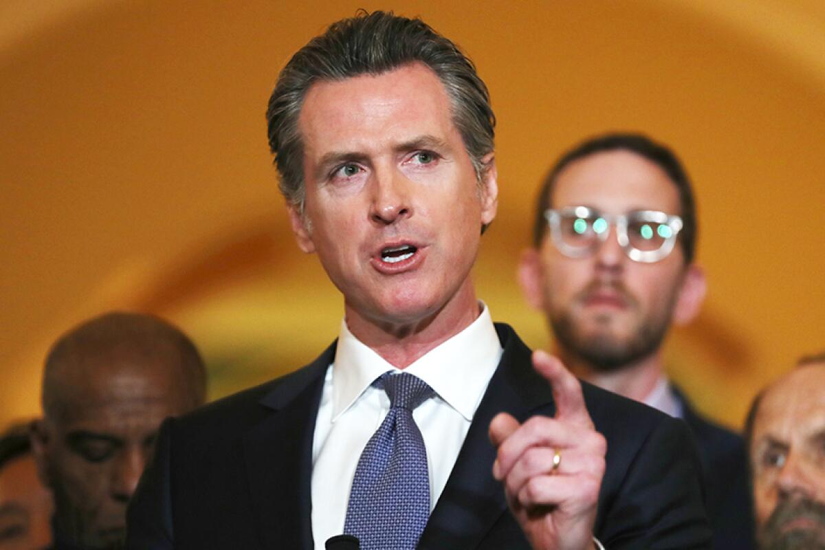 California Gov. Gavin Newsom speaks during a news conference in Sacramento on March 13, 2019.