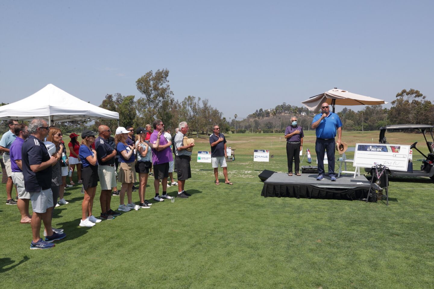 Chris Lesson of Del Mar Golf Center leads the National Anthem at the Operation Game On event