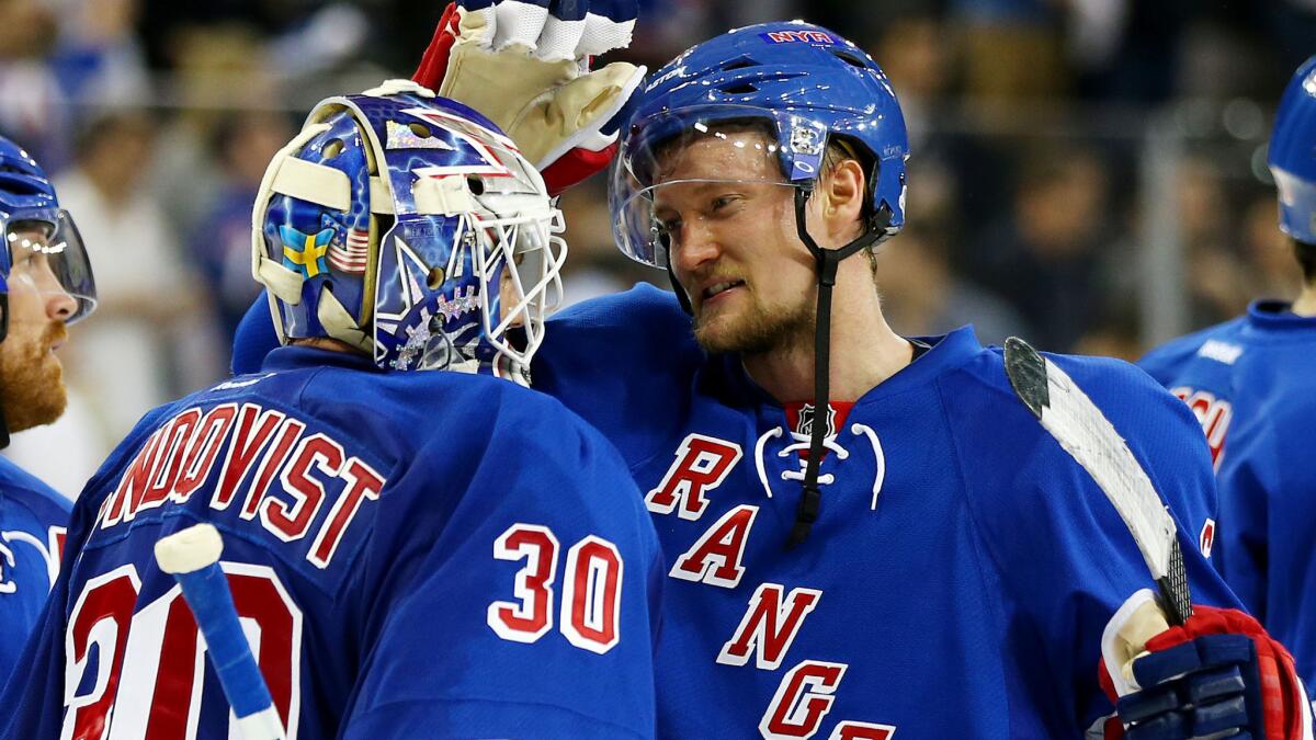 New York Rangers goalie Henrik Lundqvist, left, celebrates with teammate Anton Stralman following the team's 3-1 win over the Pittsburgh Penguins in Game 6 of the Eastern Conference semifinals Sunday.