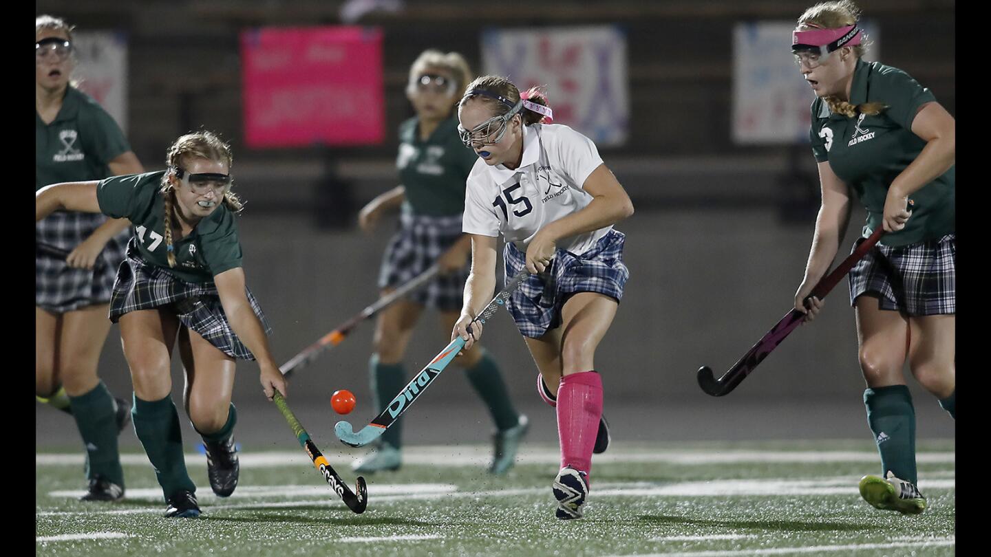 Newport Harbor High’s Lindsey Blanchfield (15) battles for a loose ball against Edison during the first half in a Sunset League game in Newport Beach on Wednesday, Oct. 18.