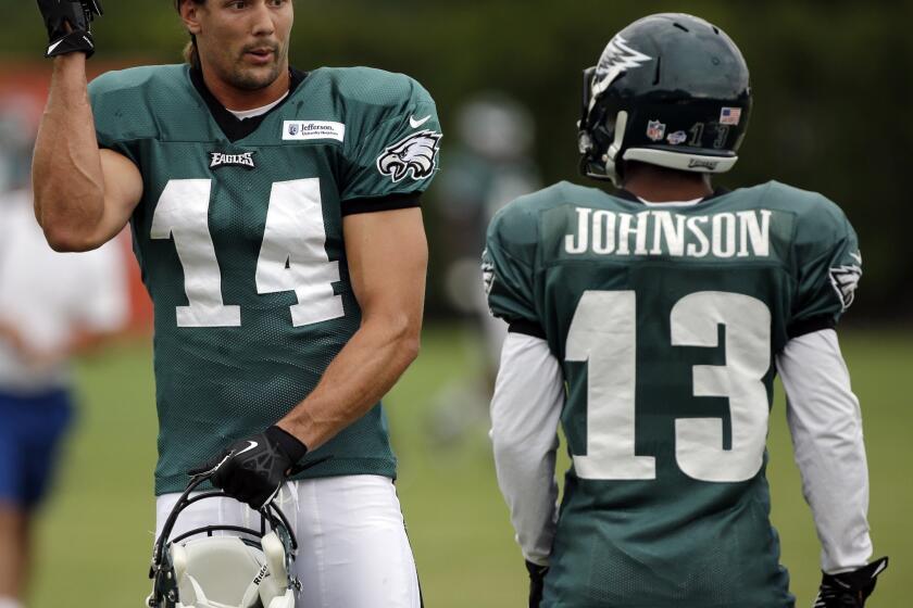 Philadelphia Eagles wide receivers Riley Cooper, left, and Damaris Johnson talk during a training camp session Tuesday.