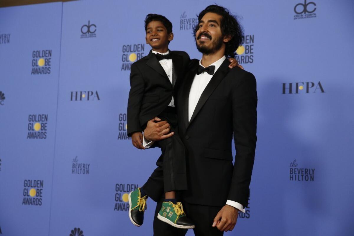 Dev Patel gives a boost to Sunny Pawar at the Golden Globes.