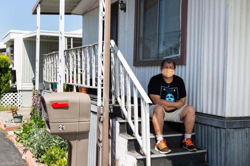 CHATSWORTH, CA - APRIL 28: Hector Ramirez poses for a portrait outside his home on Tuesday, April 28, 2020 in Chatsworth, CA. Ramirez is autistic, and COVID-19 pandemic has disrupted his daily routine. He says that he has been using coping mechanisms to help him deal with his isolation. (Gabriella Angotti-Jones / Los Angeles Times)