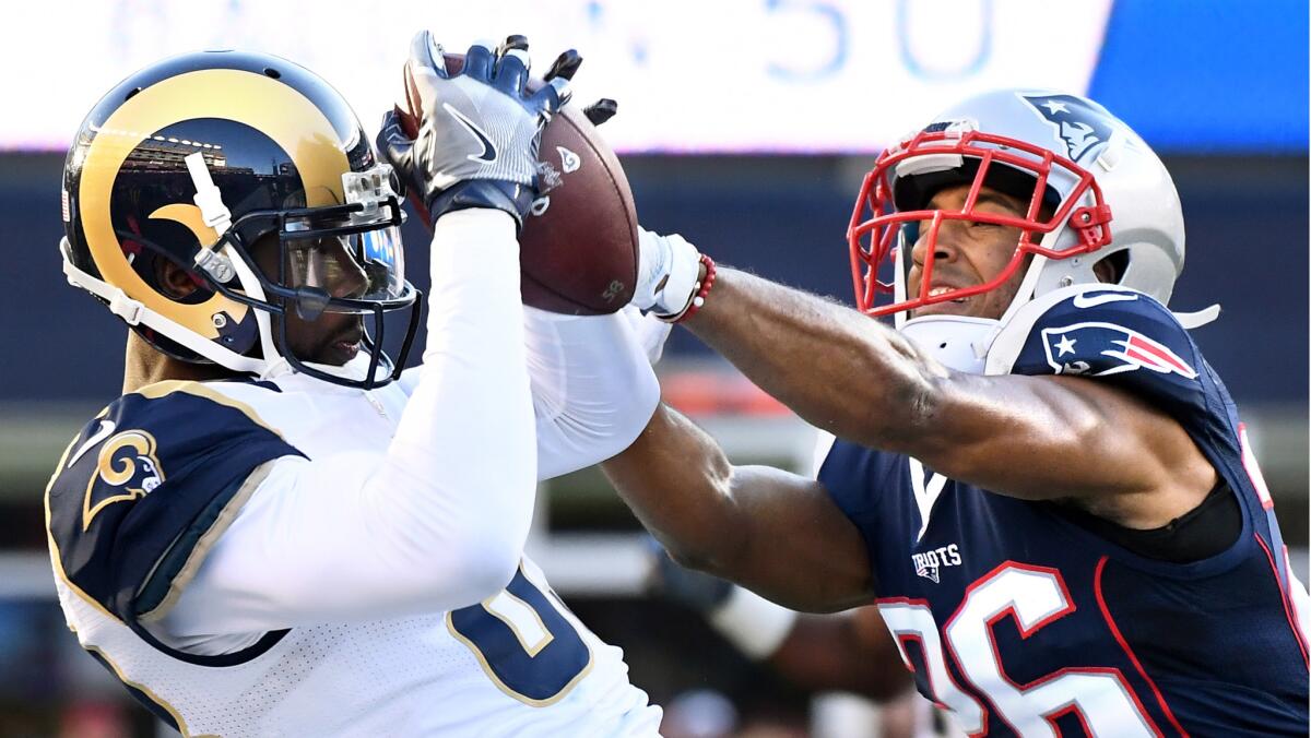 Rams receiver Brian Quick mkaes a catch in front of Patriots cornerback Logan Ryan during the third quarter.