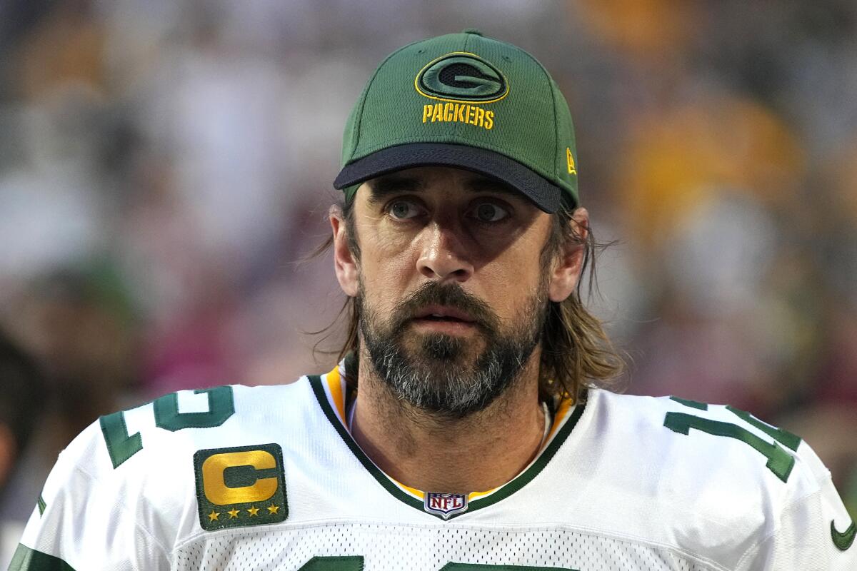 Green Bay Packers quarterback Aaron Rodgers looks on during a game.