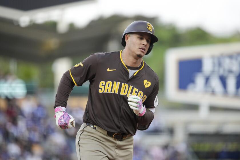San Diego Padres designated hitter Manny Machado runs the bases after hitting a home run during the fourth inning of a baseball game against the Los Angeles Dodgers Sunday, April 14, 2024, in Los Angeles. (AP Photo/Eric Thayer)