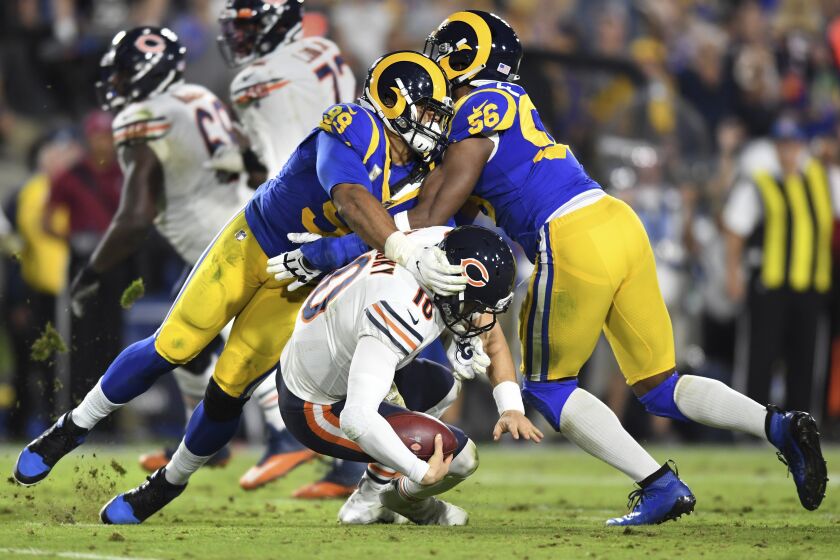 Wally Skalij  Los Angeles Times AARON DONALD, left, and Dante Fowler Jr. sack Bears quarterback Mitchell Trubisky in the fourth quarter, but a penalty was called on the Rams, wiping out the play. Donald still finished with two sacks.
