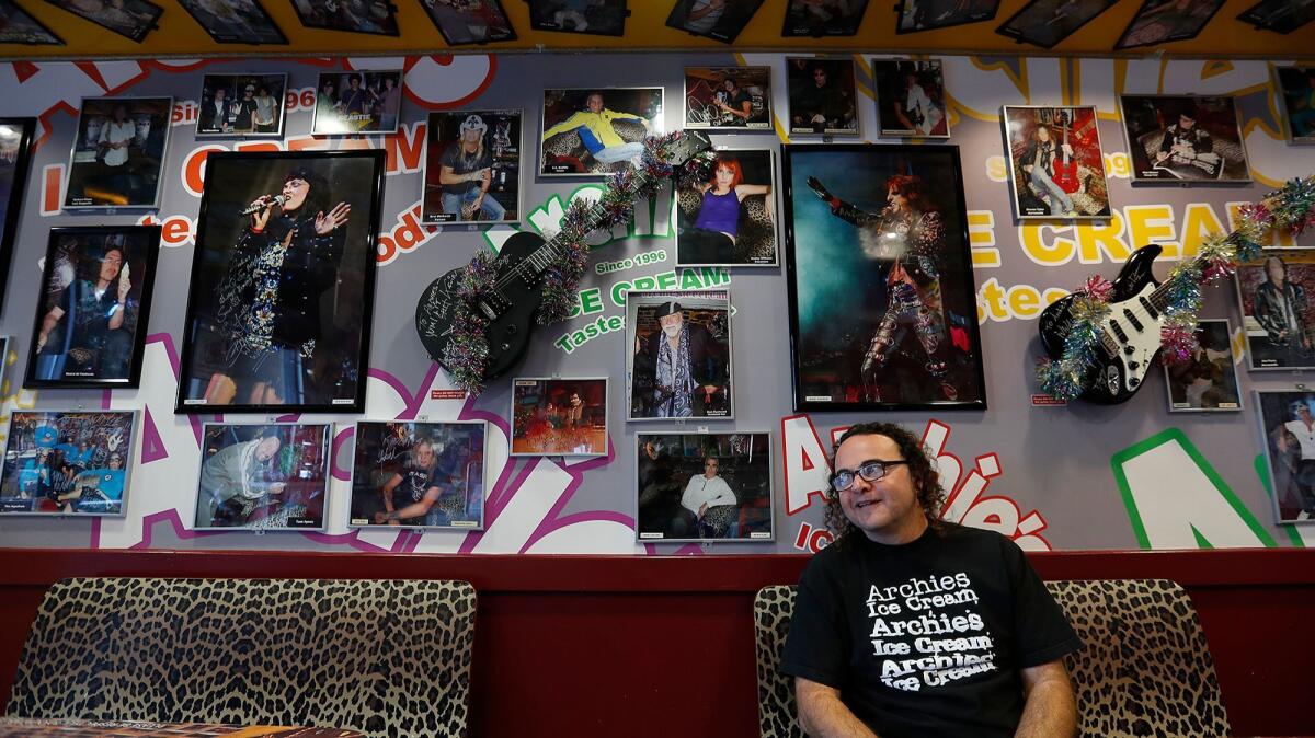 The walls of Archie's Ice Cream shop in Tustin are adorned with autographed photos and guitars from famous musicians.