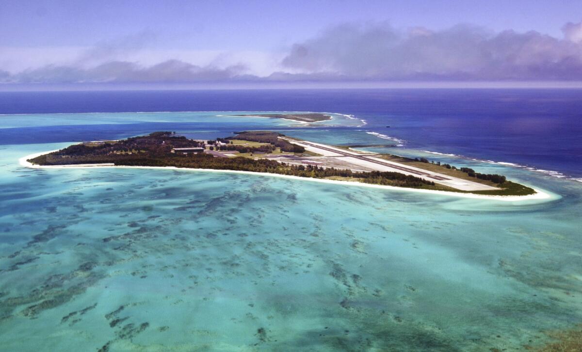 Midway Atoll, pictured in 2002, was the site of a major turning point in World War II's Pacific theater. A new battle is pitting preservation of its vaunted military history against the protection of its wildlife.