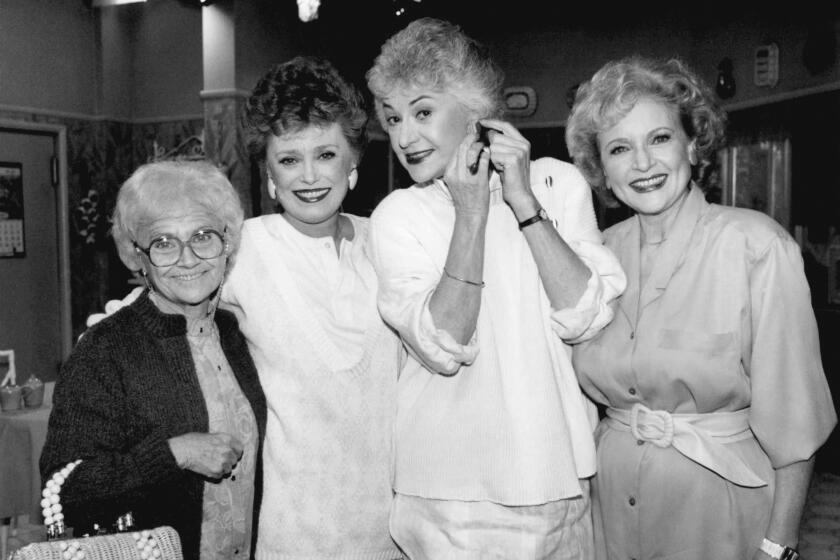 FILE - Actors from the television series "The " Golden Girls" stand together during a break in taping Dec. 25, 1985 in Hollywood. From left are, Estelle Getty, Rue McClanahan, Bea Arthur and Betty White. Betty White, whose saucy, up-for-anything charm made her a television mainstay for more than 60 years, has died. She was 99. (AP Photo/Nick Ut, File)