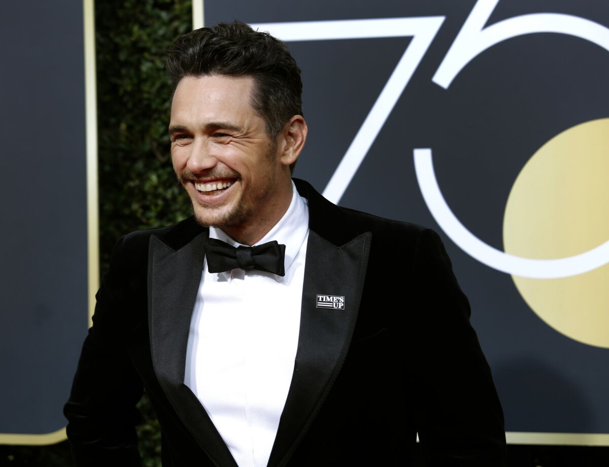 James Franco appears at the Golden Globe Awards wearing a Time's Up pin.