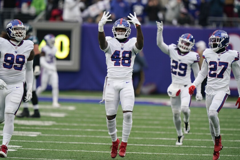 New York Giants' Tae Crowder (48) celebrates his interception during the first half of an NFL football game against the Philadelphia Eagles, Sunday, Nov. 28, 2021, in East Rutherford, N.J. (AP Photo/Corey Sipkin)