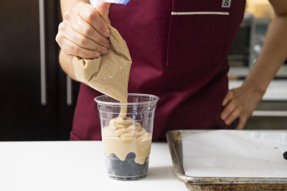 Piping pudding is faster and neater than spooning it into the cup.