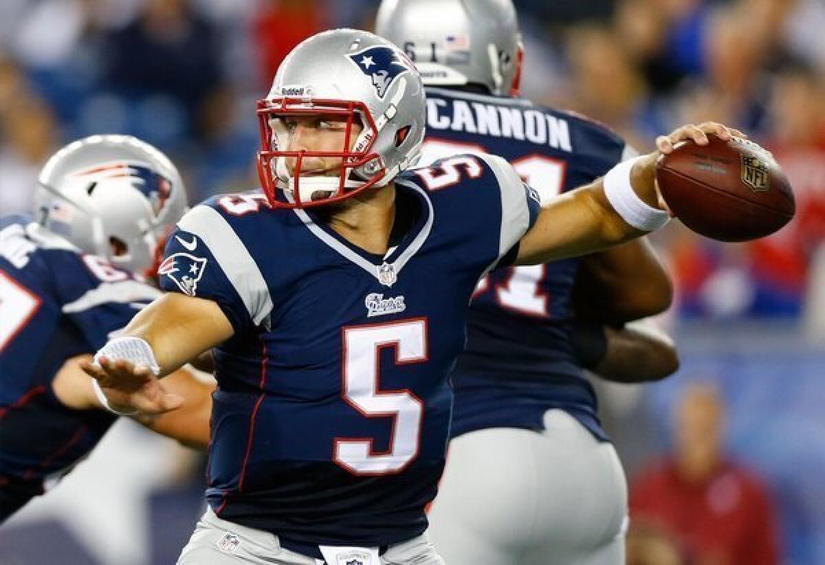 Tim Tebow of the New England Patriots throws a pass against the New York Giants on Aug. 29.