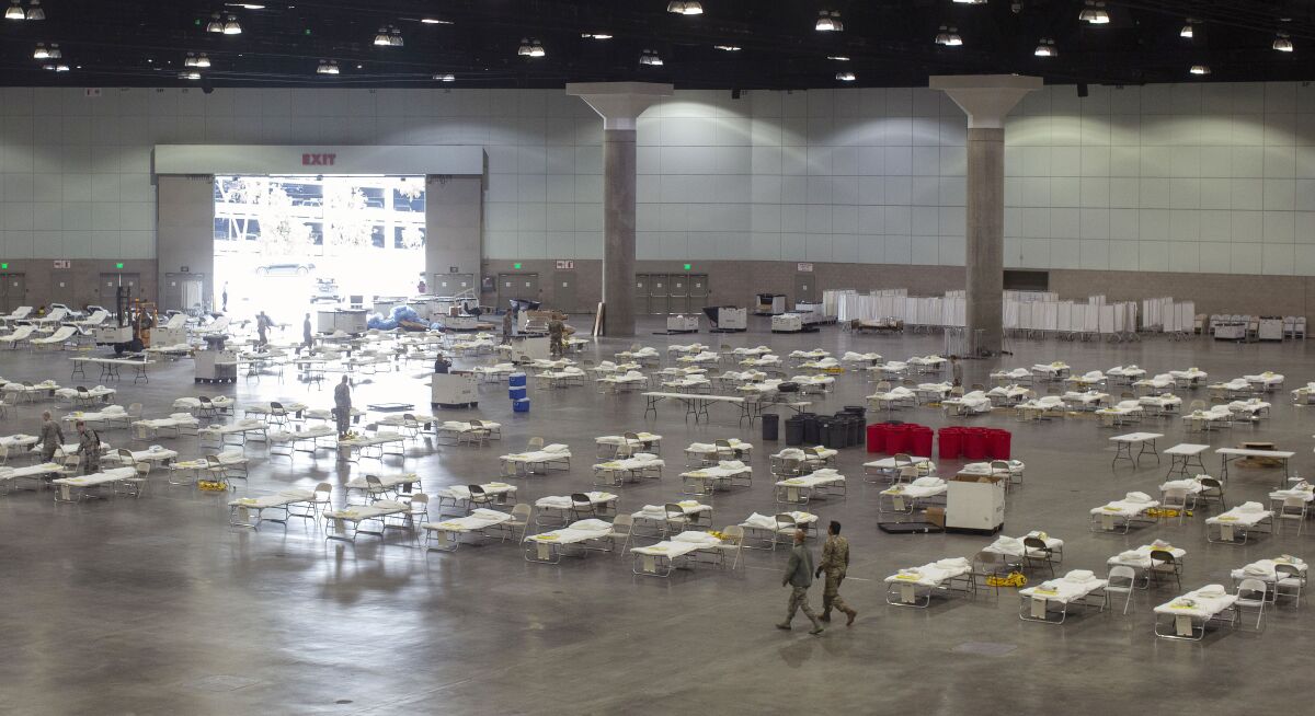 Cots line the floor of the Los Angeles Convention Center for its possible use as a field hospital.