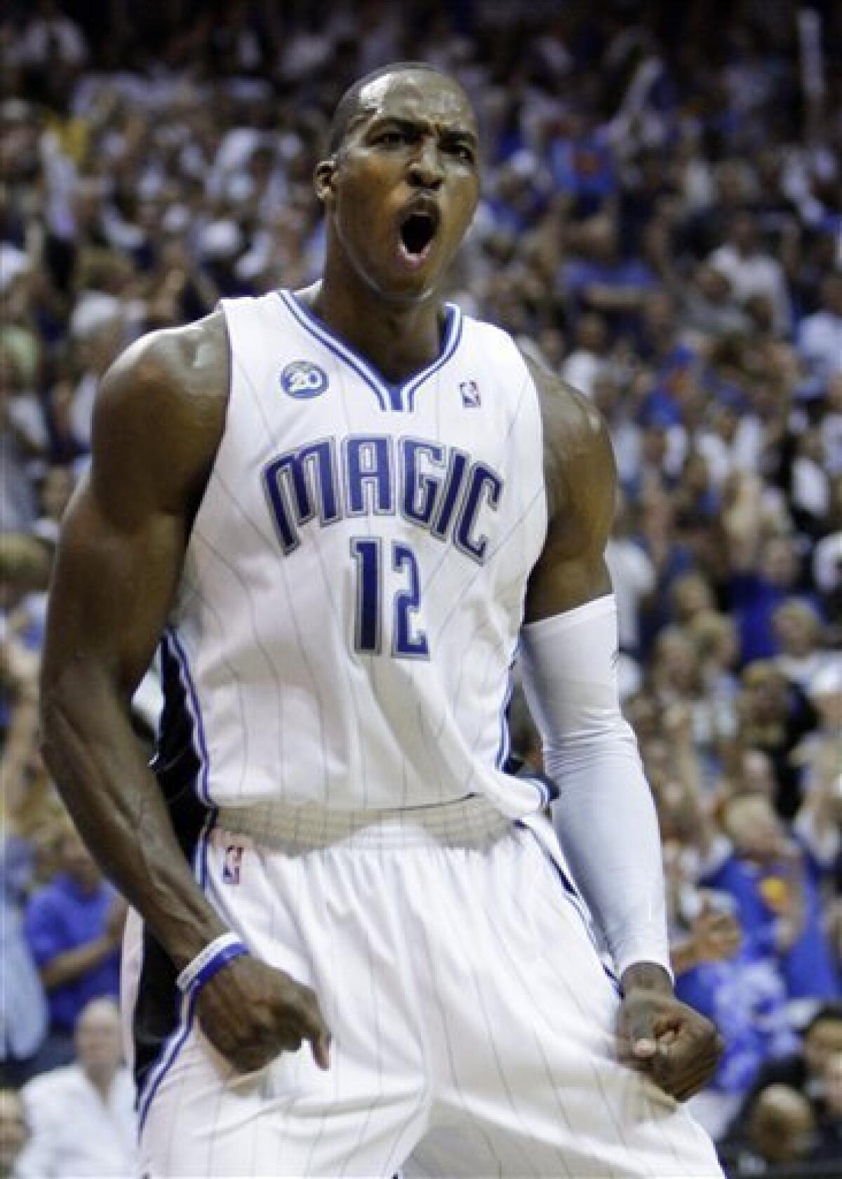 Orlando Magic's Dwight Howard reacts after a fourth quarter dunk against the Cleveland Cavaliers in Game 6 of the NBA Eastern Conference basketball finals Saturday, May 30, 2009, in Orlando, Fla. (AP Photo/John Raoux)