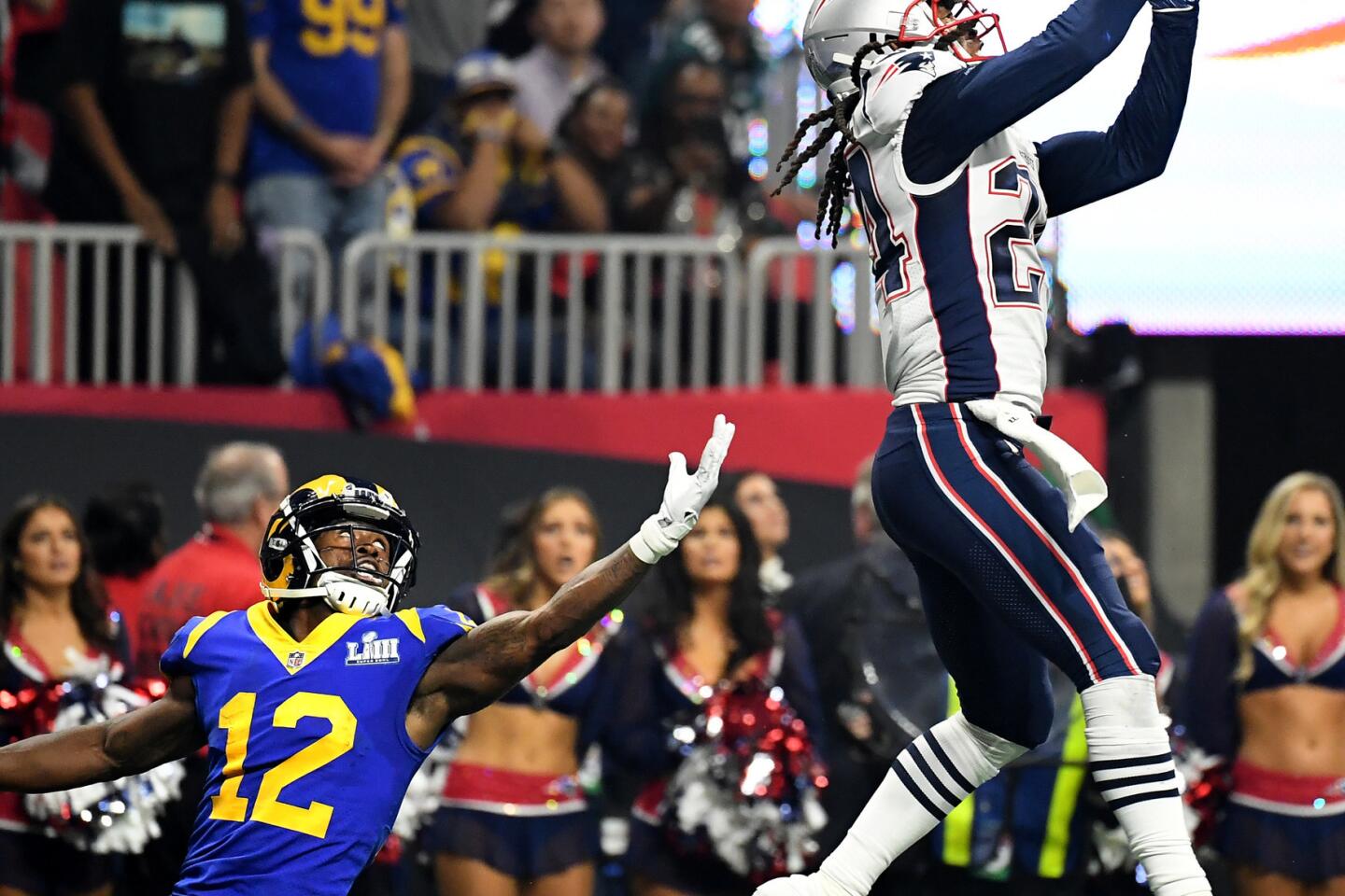 Los Angeles Rams running back Todd Gurley spits water as he sits