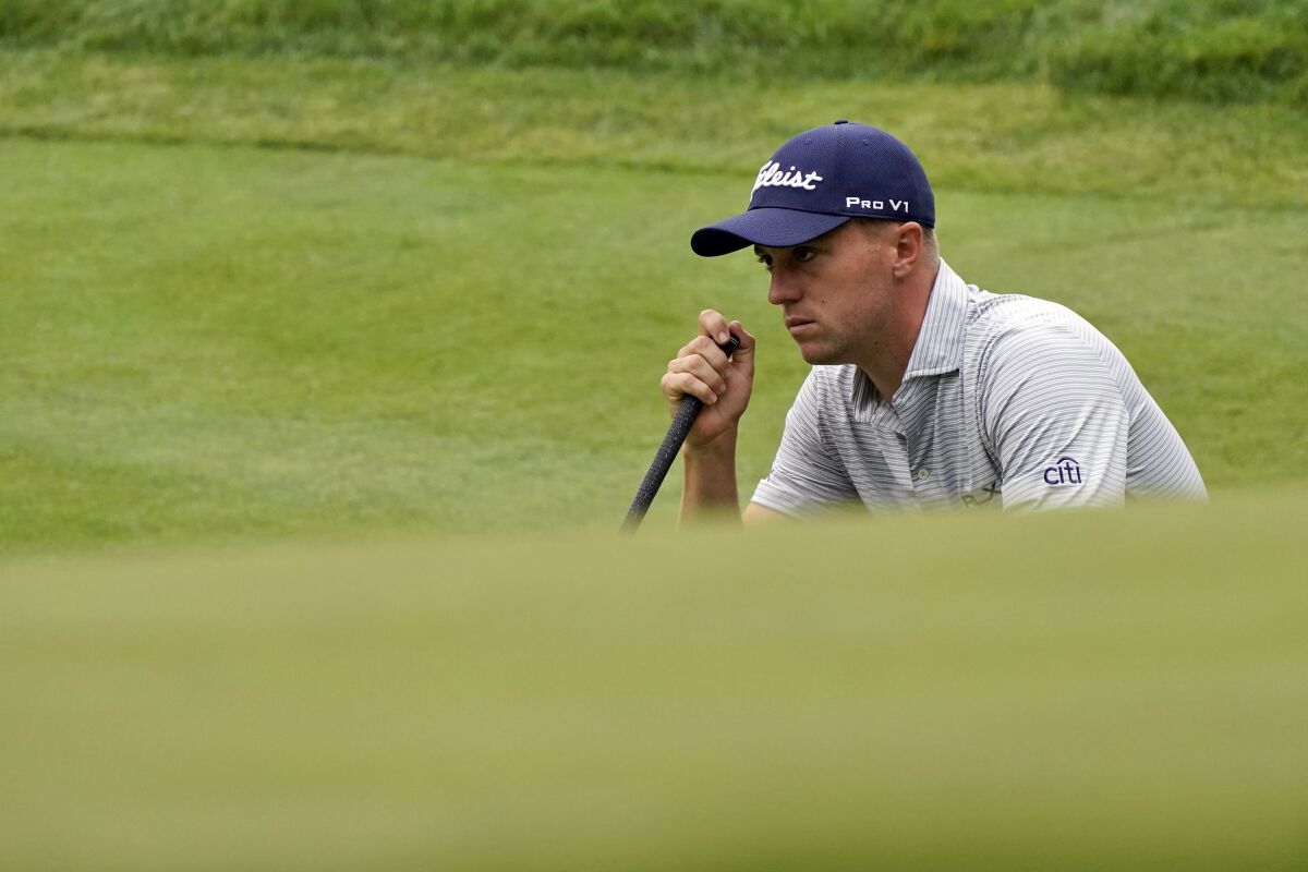 Justin Thomas reads his putt on the ninth green during the second round of the Zozo Championship on Oct. 23, 2020.