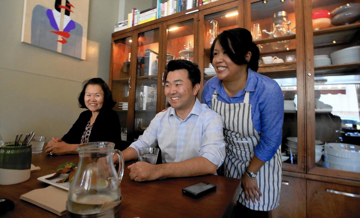 L.A. City Councilman-elect David Ryu celebrates his election victory with his mother, Michelle, left, and restaurant owner Jennyfer Rodgers at Epicurean Umbrella in Los Feliz. Ryu ran on the idea that the status quo is not working at City Hall.