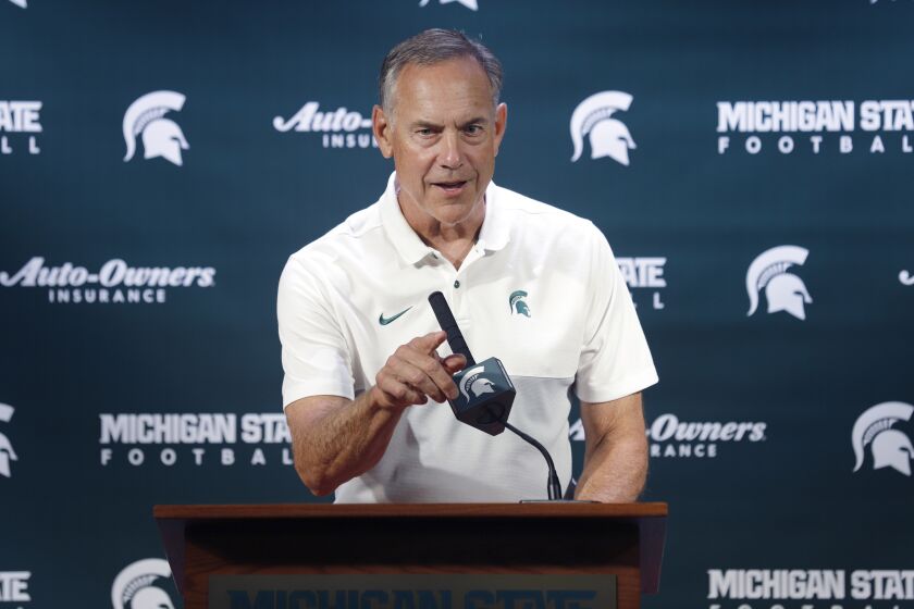 Michigan State football coach Mark Dantonio talks with reporters during the team's media day on August 5.