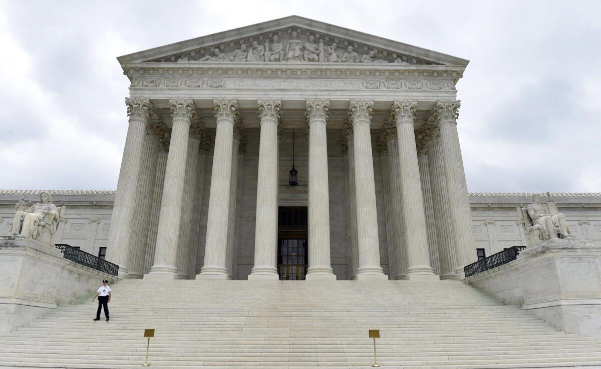 The U.S. Supreme Court recently heard a case in which the federal government defined illegal possession of a gun as a "violent felony." Above, the Supreme Court building in Washington.