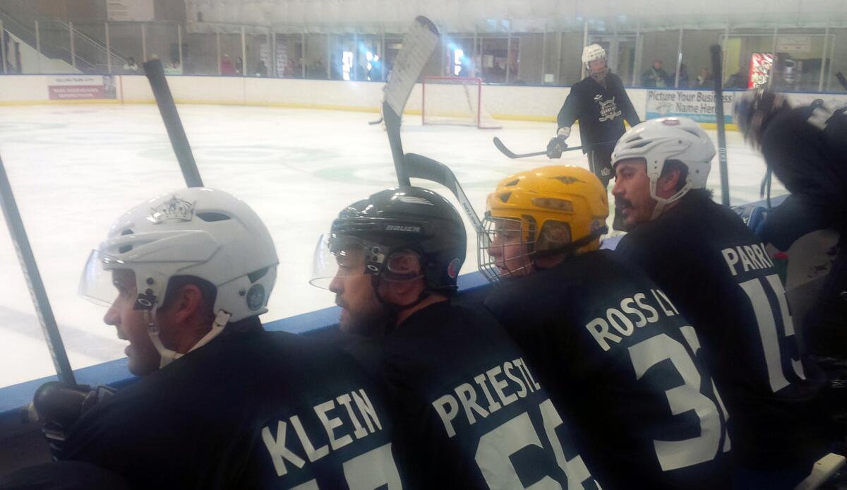 Former Galaxy star Chris Klein, left, actor Jason Priestley, R5 member Ross Lynch and former NHL player George Parros on the bench during the Echoes of Hope exhibition game at the Sundance Film Festival.