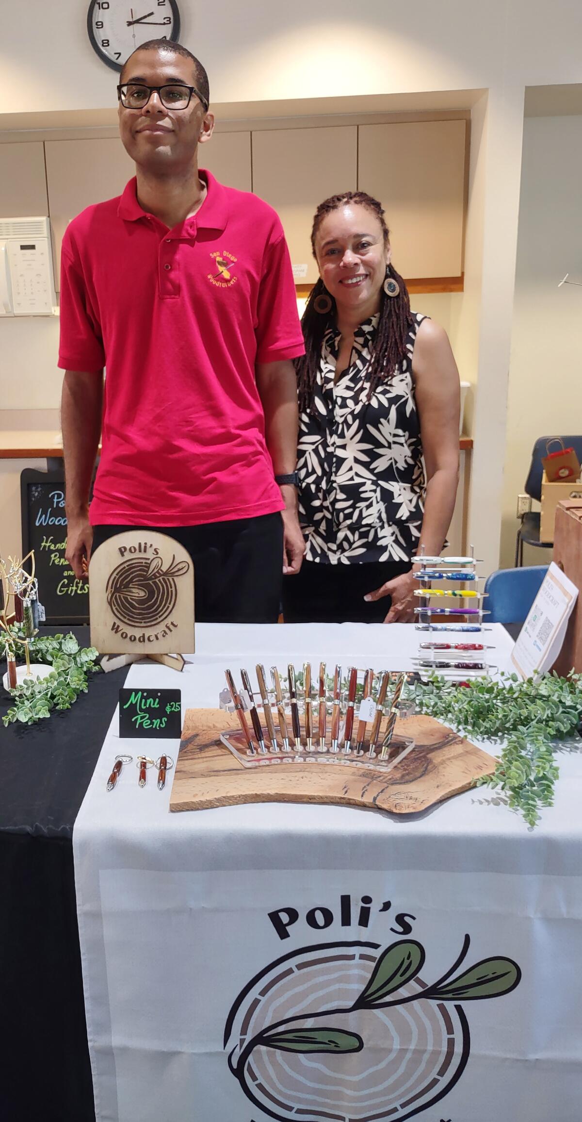 Poli’s Woodcraft owner Policarpo “Poli” Despaigne, left, makes pens and sells them with help from his mom, Jamaye Despaigne.