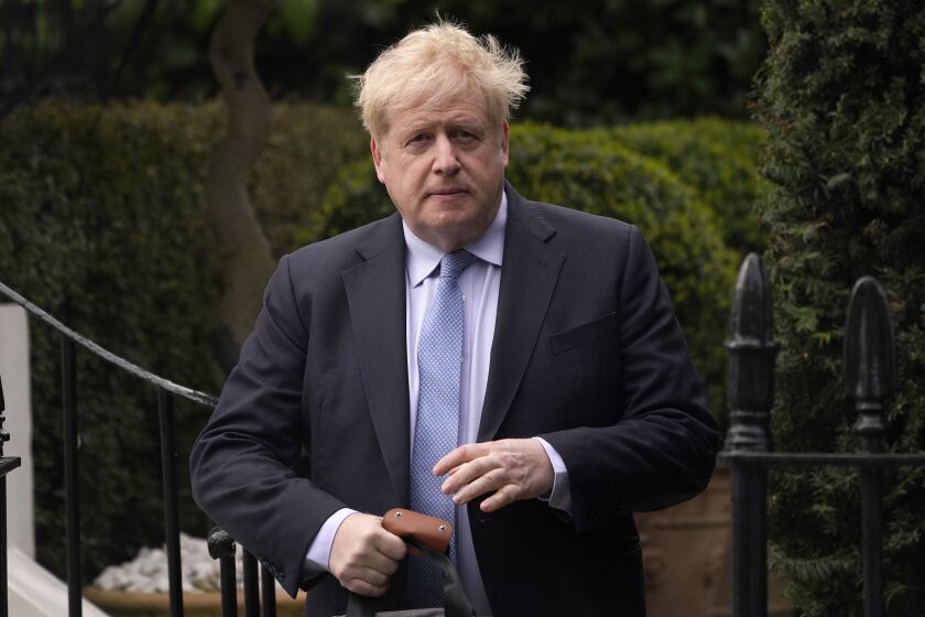 Boris Johnson leaves his house in London, Wednesday, March 22, 2023. Britain's former prime minister faces a grilling Wednesday by a committee of lawmakers over whether he misled Parliament about rule-breaking parties in government buildings during the coronavirus pandemic. (AP Photo/Alberto Pezzali)