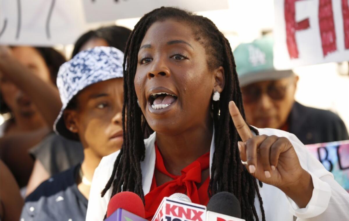 Jasmyne Cannick speaks during a news conference with Black Lives Matter Los Angeles activists in July.