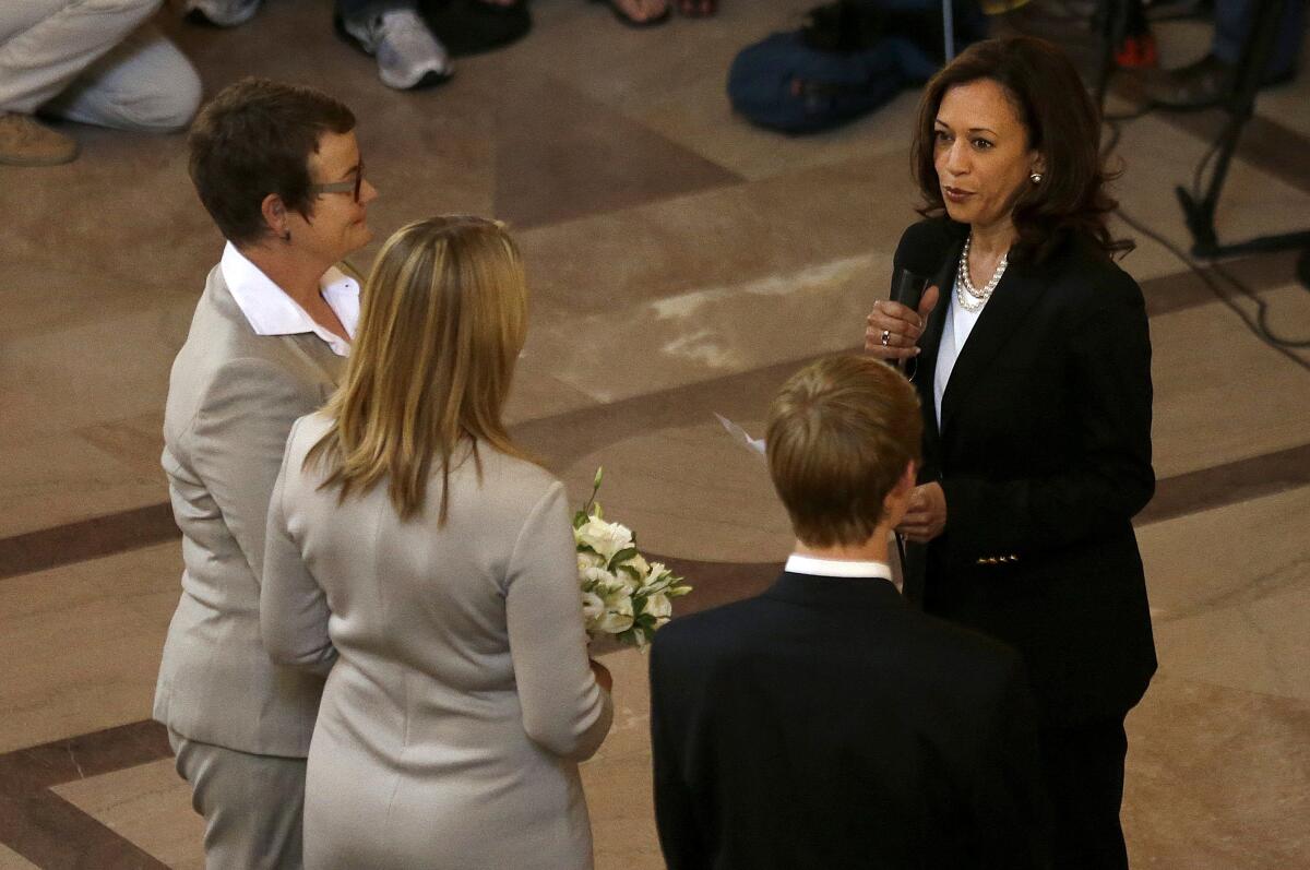 Kamala Harris officiates at the wedding of two women.