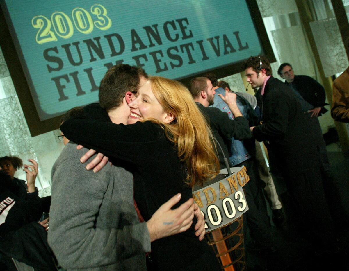 Actress Patricia Clarkson, winner of the Special Jury Prize for Outstanding Performance, hugs director Tom McCarthy, winner of the Dramatic Audience Award and the Waldo Salt Screenwriting Award for the film, "The Station Agent," at the Sundance Film Festival awards show Saturday night in Park City, Utah. Clarkson, who stars in, "The Station Agent," performed in a total of four films at the festival.