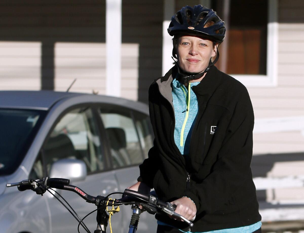 Nurse Kaci Hickox leaves her home on a rural road in Fort Kent, Me., to take a bike ride with her boyfriend Ted Wilbur.