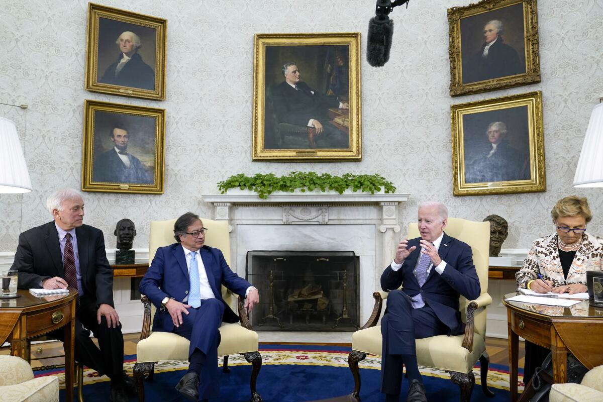 Colombian President Gustavo Petro, President Biden and others seated in the Oval Office