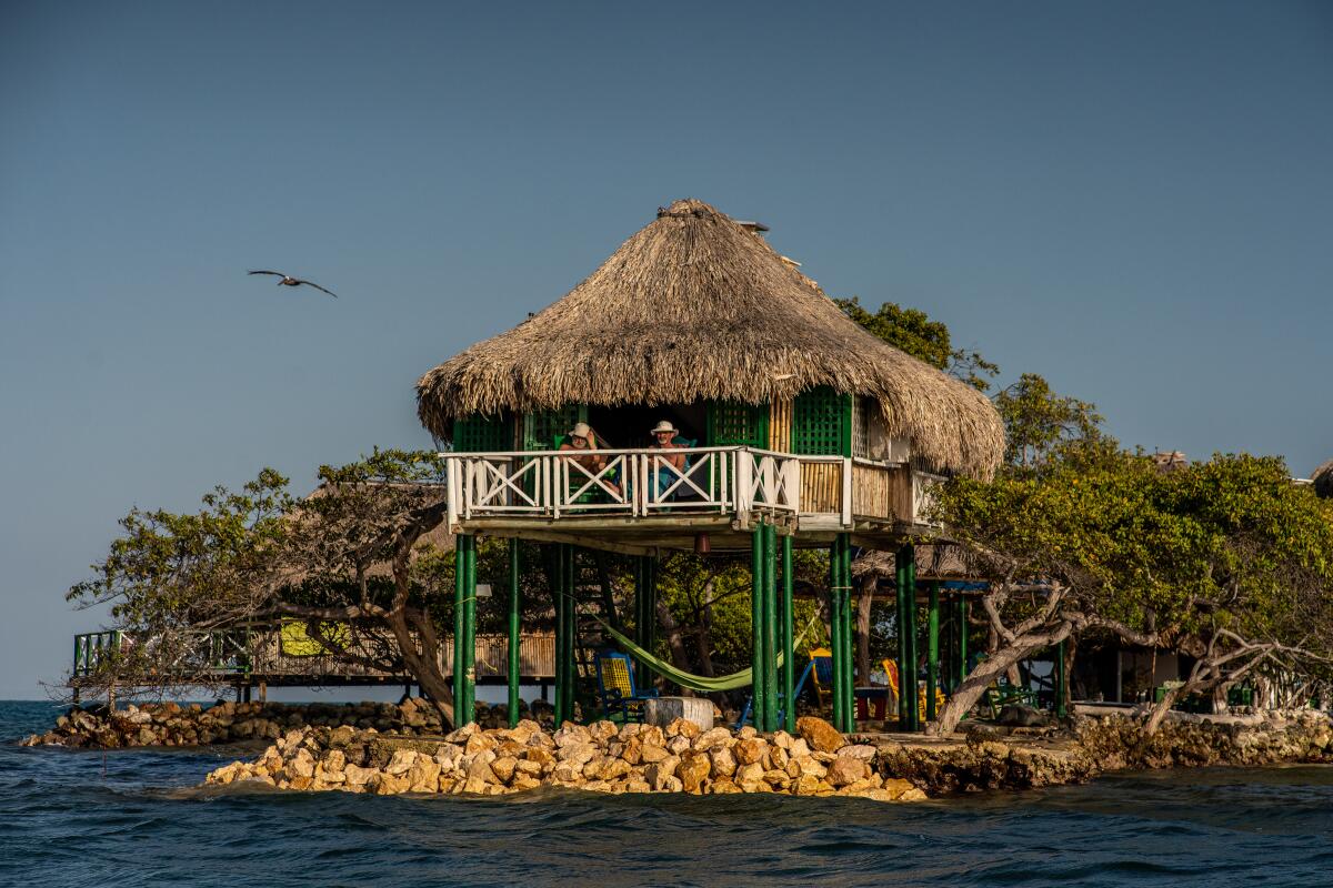 A thatched-roof house on stilts on the shore of Tintipán, an island about 40 minutes off the Colombian coast.