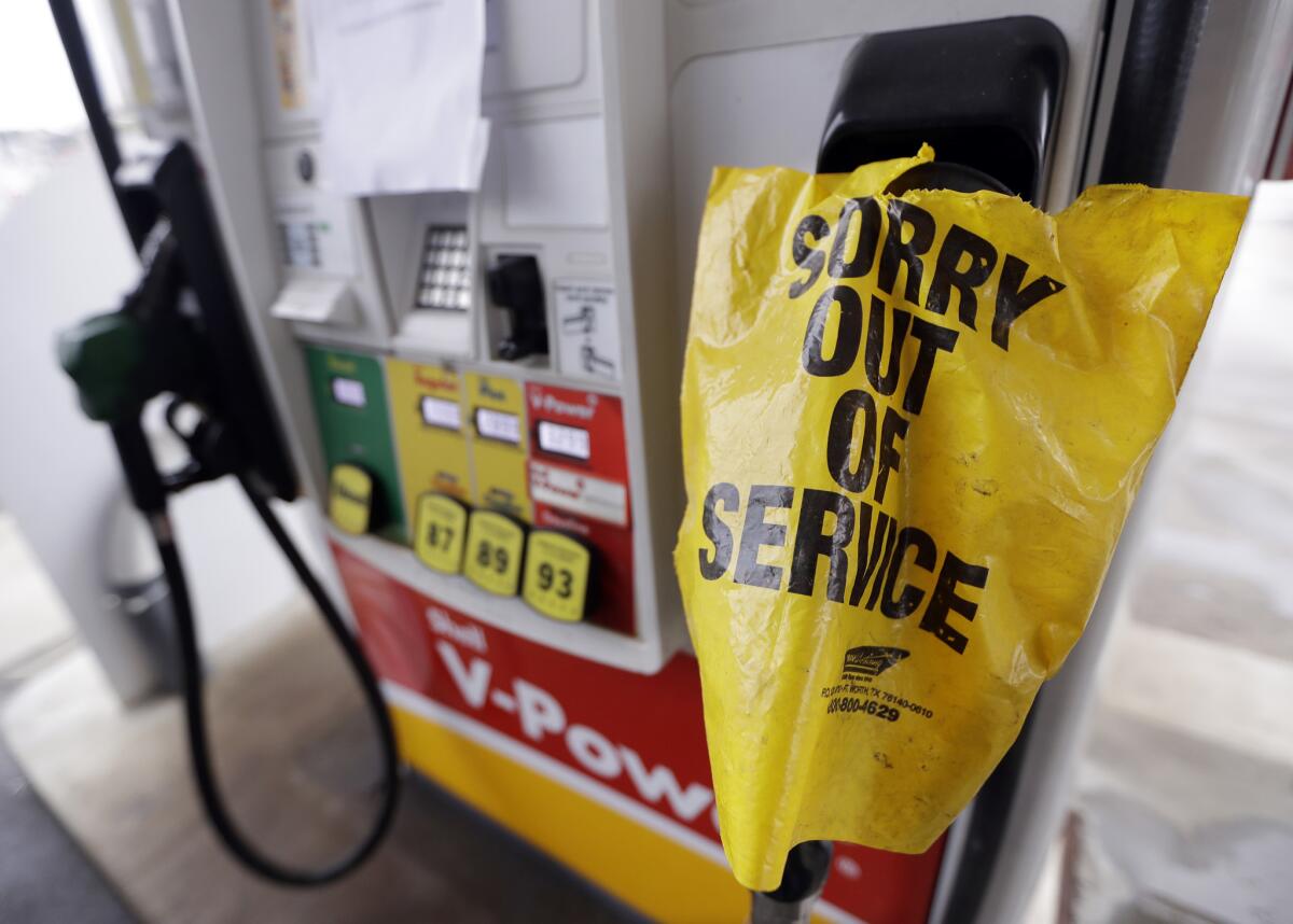 A "out of service" bag covers a pump handle at a Nashville gas station that has no fuel to sell on Sept. 17.