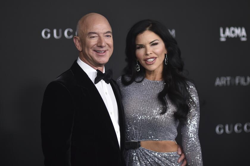 Jeff Bezos, left, and Lauren Sanchez arrive at a formal event