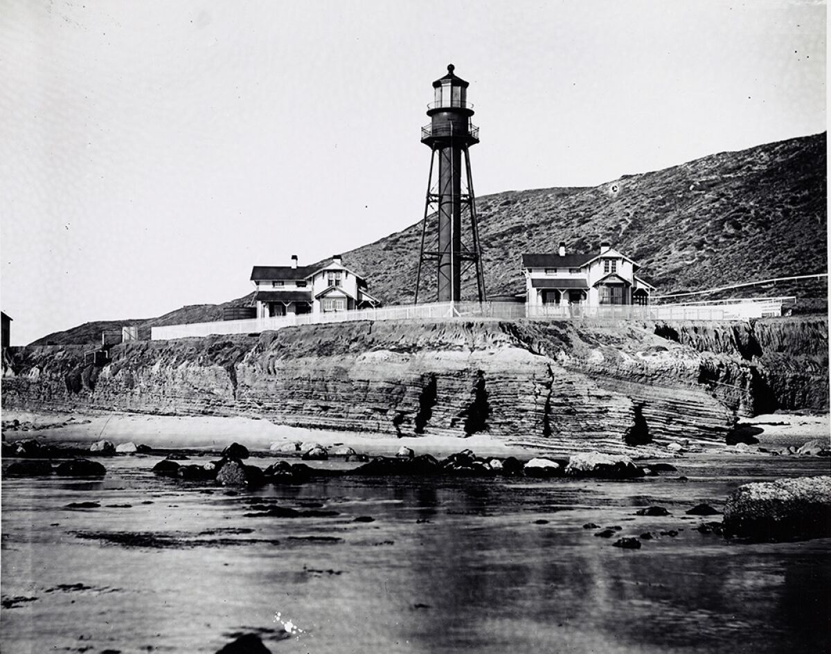 The re-established Point Loma Light Station is pictured in 1895 in its original dark color.