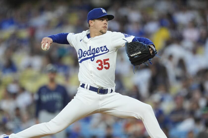 Los Angeles Dodgers pitcher Gavin Stone throws to a Los Angeles Dodgers batter.