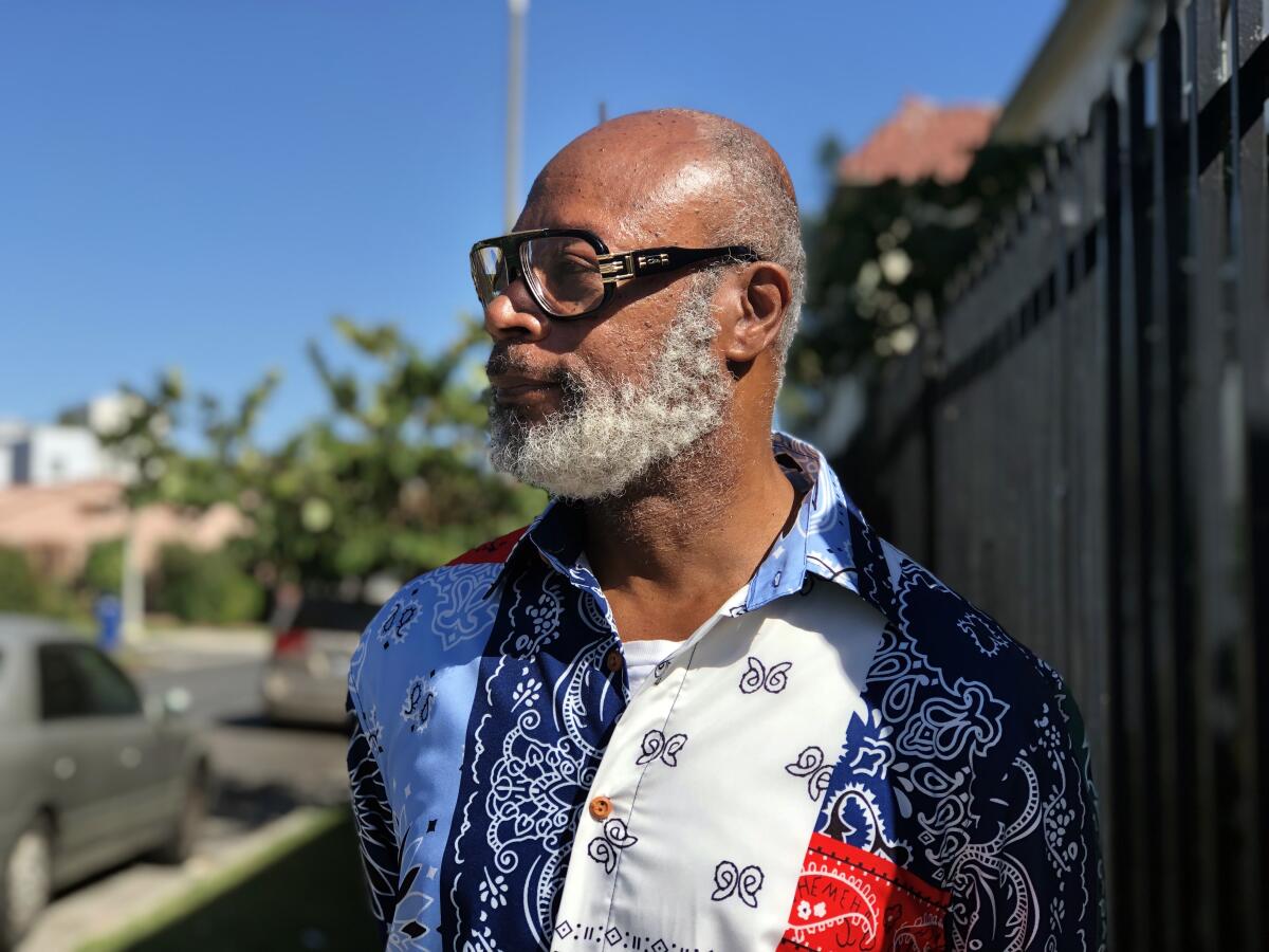 Larry Campbell, 61, a retired Southern California Edison worker, poses in the Jefferson Park neighborhood of Los Angeles.