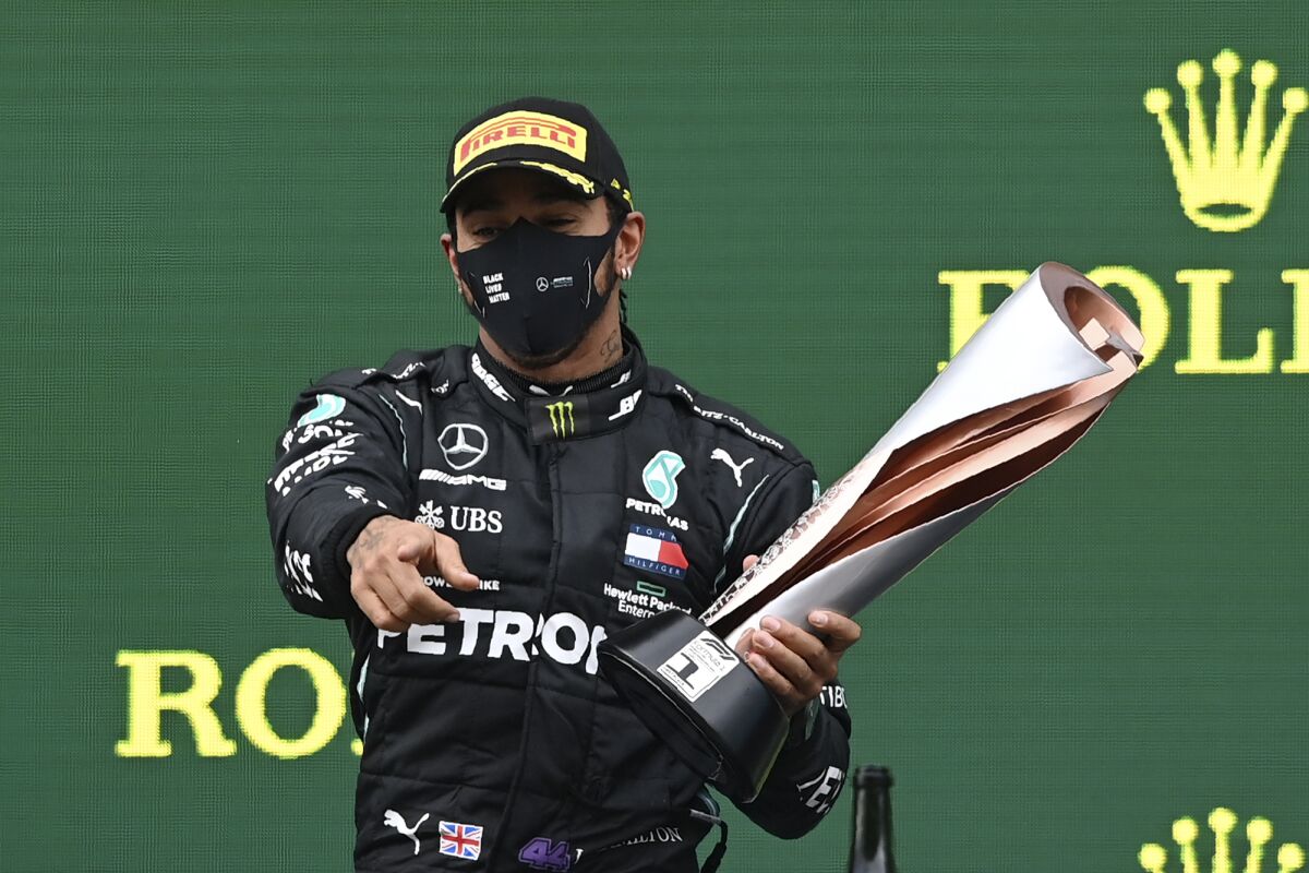 Mercedes driver Lewis Hamilton celebrates on the podium after winning the Formula One Turkish Grand Prix on Sunday.