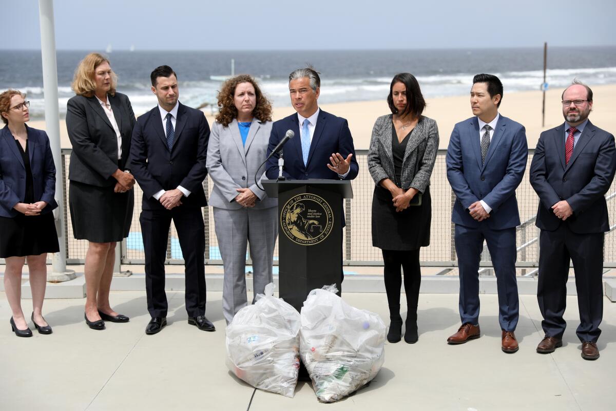 California Attorney General Rob Bonta, flanked by his legal team.