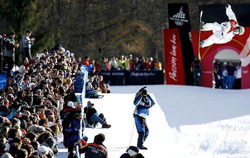 Danny Kass soars through the air during the snowboard halfpipe competition.