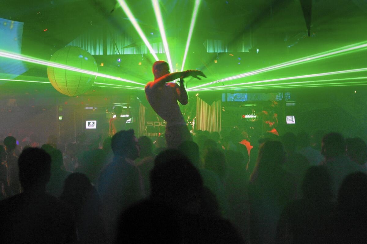 Laser lighting streaks through the crowded dance floor at Circus Disco in 2006. Hundreds of apartments are planned at the site of the now-closed club.