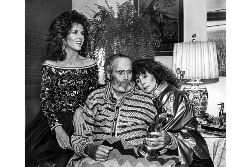 March 29, 1982: Henry Fonda, with wife Shirlee and daughter Jane, gets a good look at his Oscar at his home in Bel-Air. The acting award for "On Golden Pond" was his first, though he was unable to go to the ceremony.
