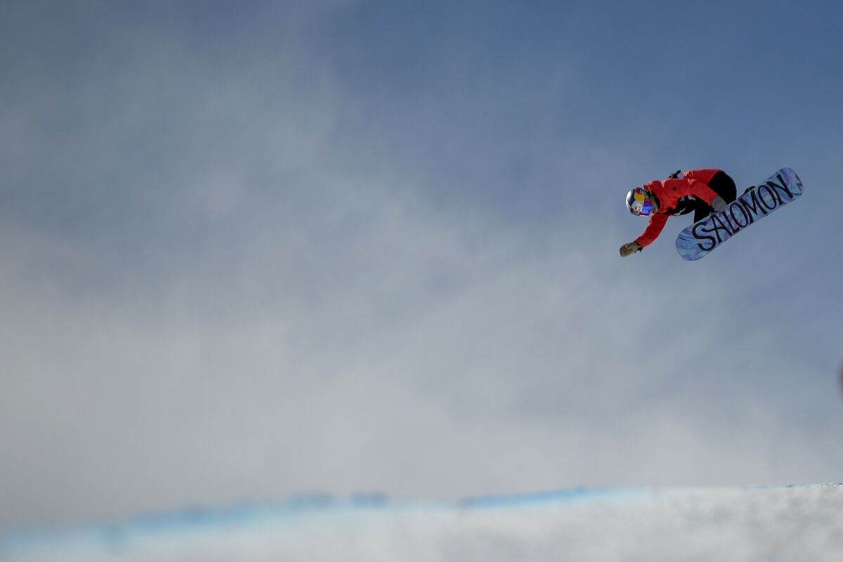 FILE- Maddie Mastro, of the United States, competes in the women's snowboard halfpipe final at the freestyle ski and snowboard world championships, Friday, Feb. 8, 2019, in Park City, Utah. Mastro has sketched out a trick in her notebook that just may help her land on the podium at the 2022 Beijing Games, maybe even on the top step. It's called the front double 1080 and includes two flips and a 360-degree rotation with a backward landing. (AP Photo/Alex Goodlett, File)