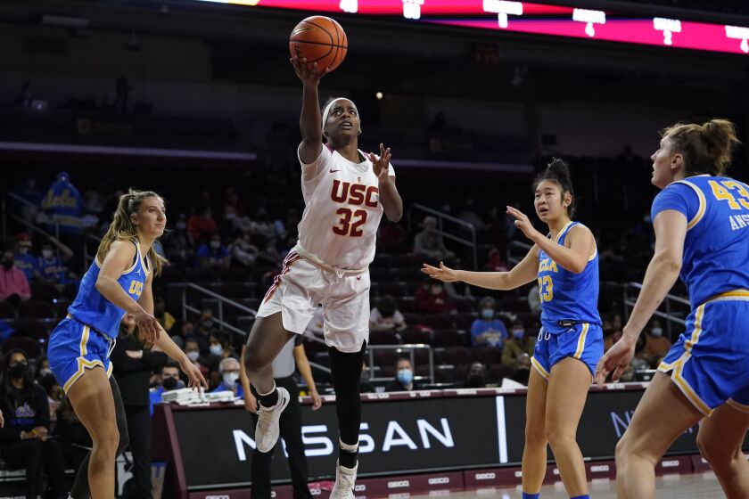 Southern California forward Jordyn Jenkins (32) shoots during the first half of an NCAA college basketball game against UCLA in Los Angeles, Sunday, Jan. 23, 2022. (AP Photo/Ashley Landis)
