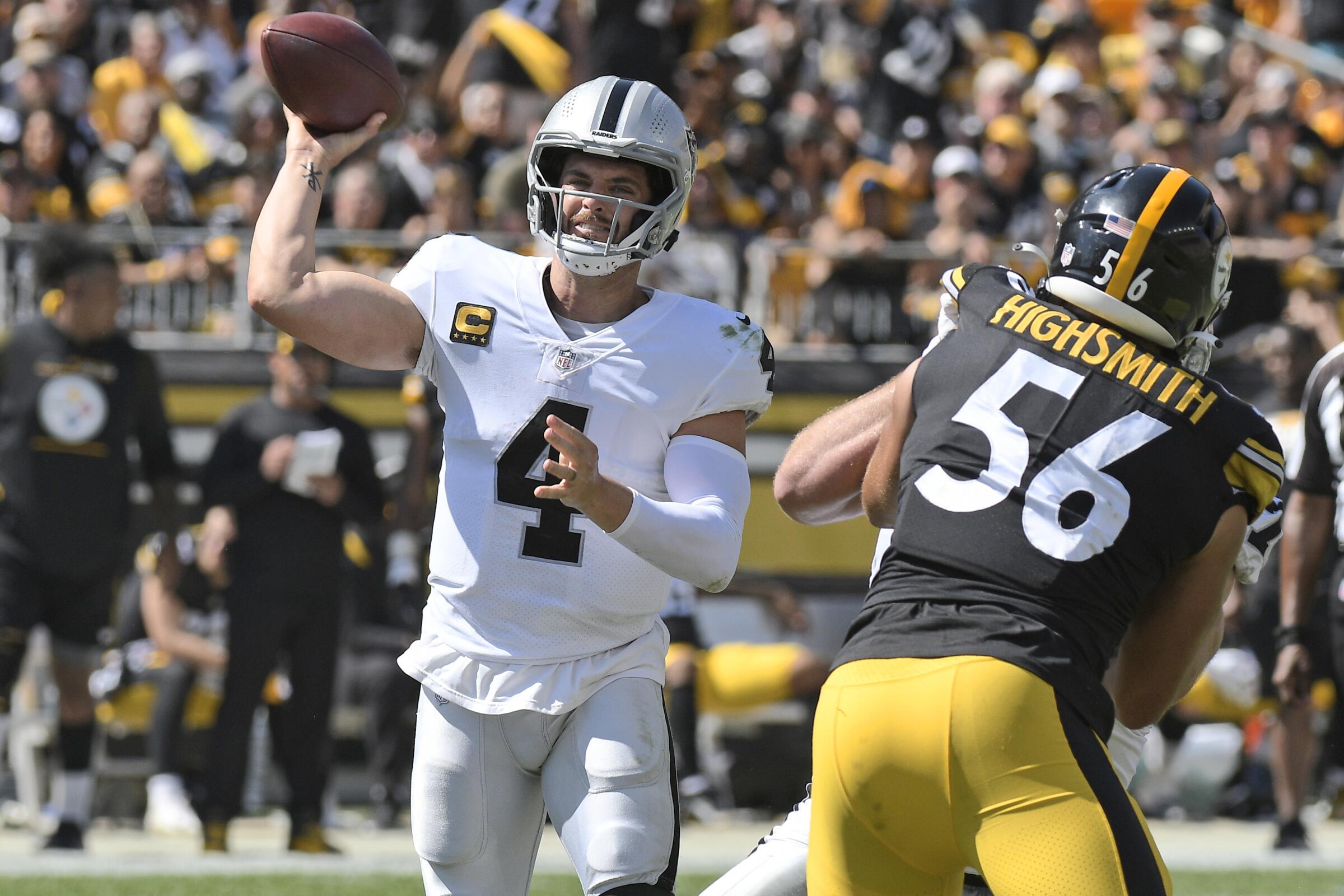 Las Vegas Raiders quarterback Derek Carr (4) throws a pass during the first half of an NFL football game.