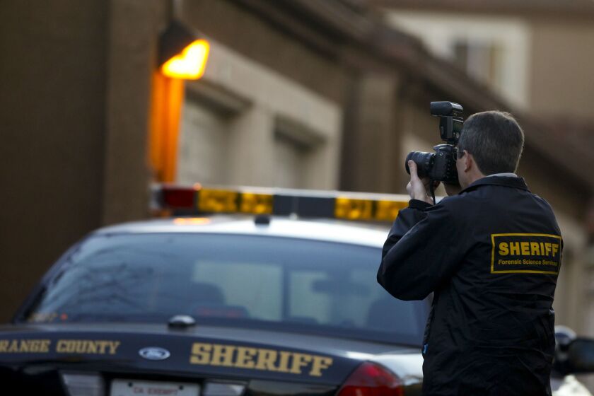 LAGUNA NIGUEL, CA., JANUARY 18, 2013: Orange County Sheriff Department crime scene technician documents the scene of a murder in Laguna Niguel where a 25-year-old man reportedly shot his 24-year-old wife to death January 18, 2013. The sheriff's department responded to the call at 1:25 a.m. in the Niguel Summit Apartment Homes at 30161 Paciifc Island Drive. The victim died a short time later at Mission Hospital in Mssion Viejo (Mark Boster/Los Angeles Times).