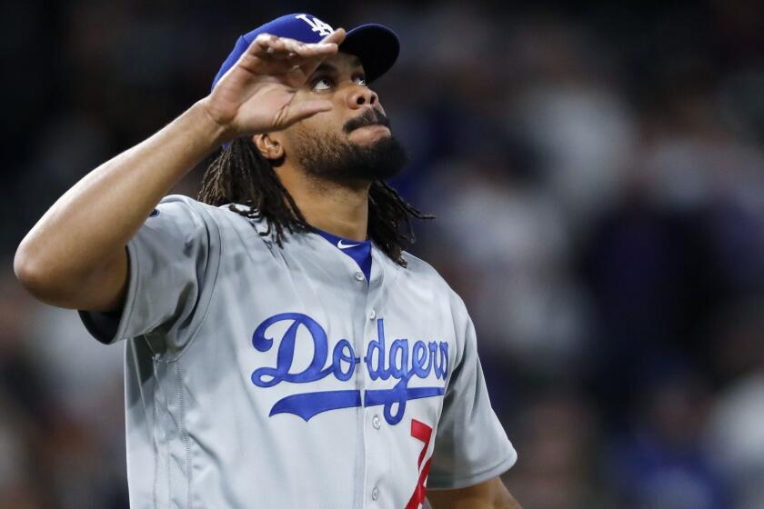 Los Angeles Dodgers relief pitcher Kenley Jansen gestures after striking out Colorado Rockies pinch-hitter Garrett Hampson for the final out of a baseball game Saturday, April 6, 2019, in Denver. The Dodgers won 7-2. (AP Photo/David Zalubowski)